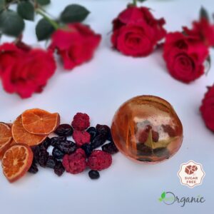 Handcrafted Winter Berry Bliss tea sphere with cranberries, cherries, raspberries, blueberries, mandarin, and sage