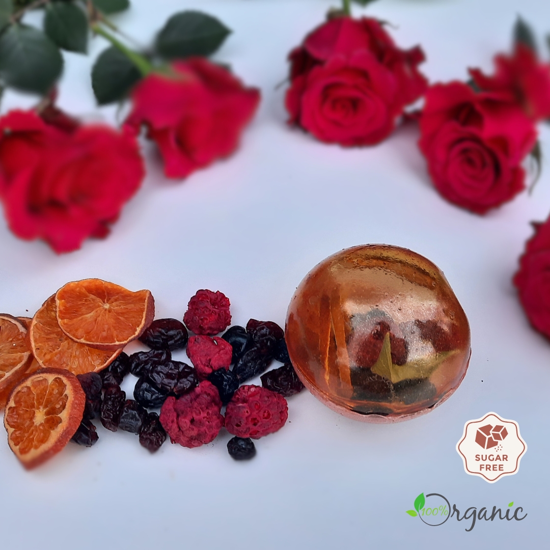 Handcrafted Winter Berry Bliss tea sphere with cranberries, cherries, raspberries, blueberries, mandarin, and sage