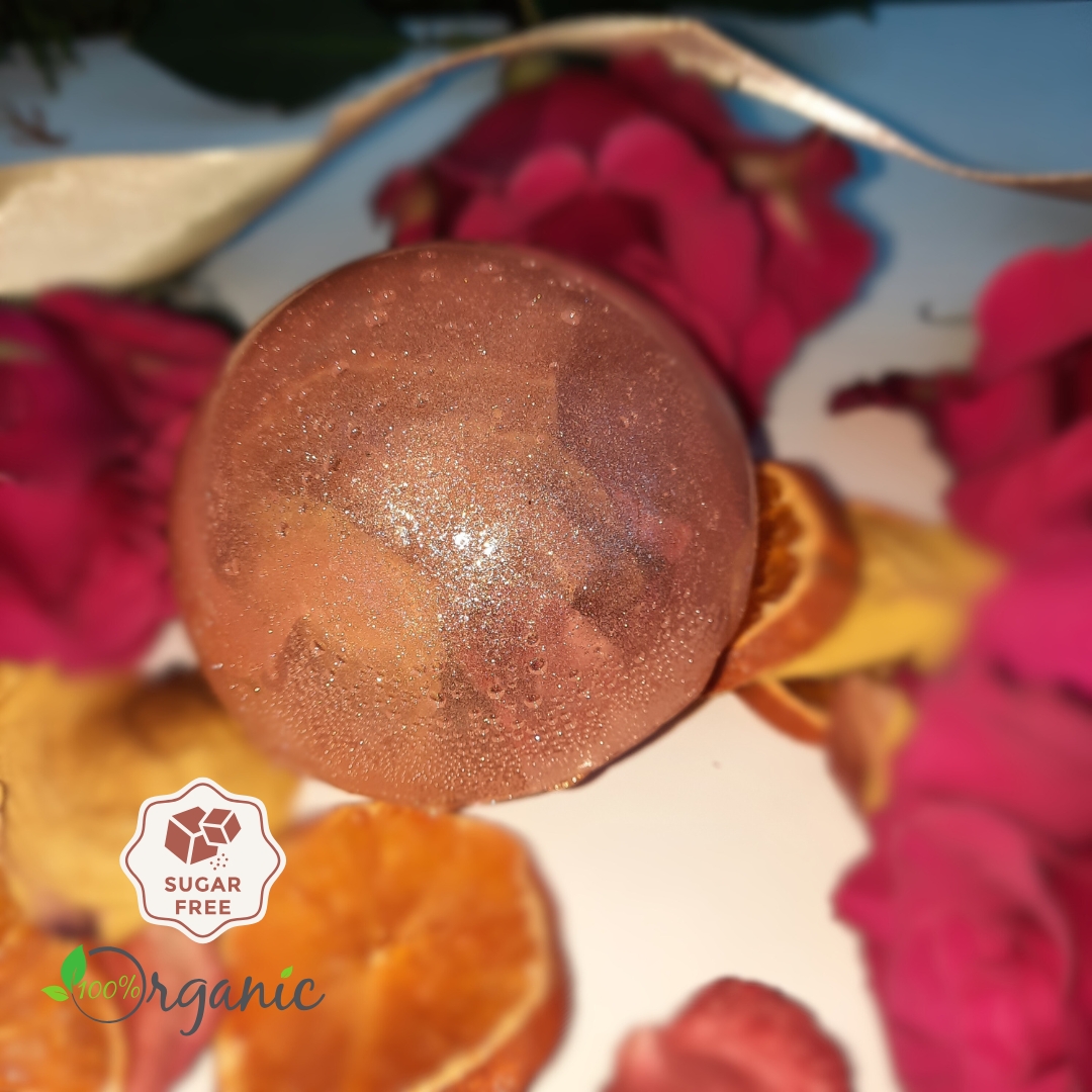 Scarlet Bliss Tea Sphere surrounded by vibrant fruits and floral elements, highlighting its natural ingredients