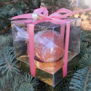 Gift box of Scarlet Bliss tea spheres, elegantly wrapped with a ribbon, perfect for festive gifting