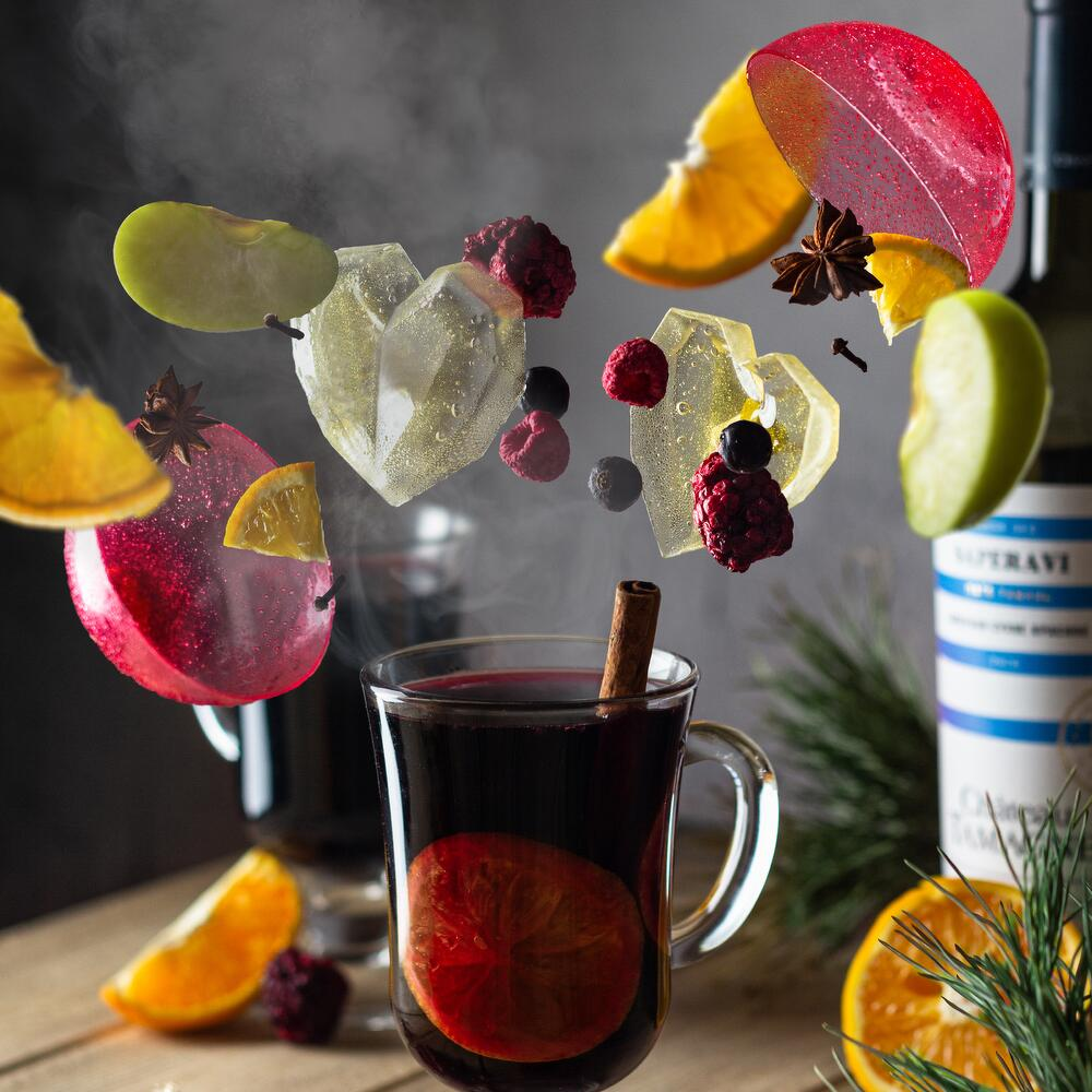 Mulled wine ingredients and preparation, styled with festive decor
