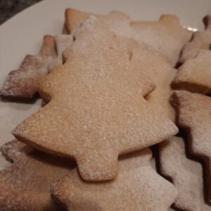 Star-shaped ginger shortbread cookies with a soft, crumbly texture, perfect for festive occasions.